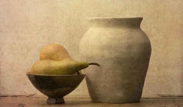 Fruit still life with pears on wooden table. Vintage rustic food image with artistic texture effect.